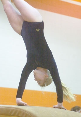 Amanda Alig, Coldwater High School gymnastics team member, participates on the vault in a February competition. The school's gymnastics program is now slated to continue another year as a varisty sport.<br>dailystandard.com