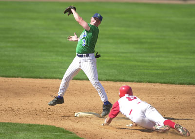 Grand Lake's Dusty Hammond, left, catches the ball at second base and tries to make a tag on a Columbus baserunner during GLSCL playoff action. Hammond had three hits, but the Mariners committed six errors in an 8-3 loss.<br>dailystandard.com