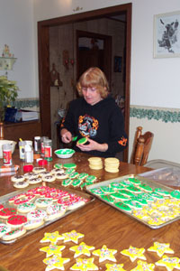 Ruth Dameron, 312 E. Elizabeth St., Coldwater, decorates another batch of Christmas cookies bound for friends, neighbors and co-workers. Each year she makes 150 dozen cutout cookies in keeping with a 20-year tradition. Her mother used to do the same thing in Midland, Mich.<br>dailystandard.com